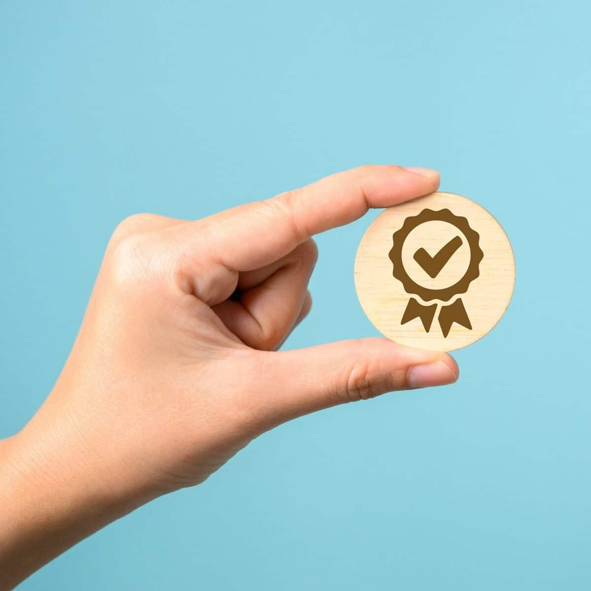 Hand holding virtual certification of quality assurance, Standardization, Good service with five